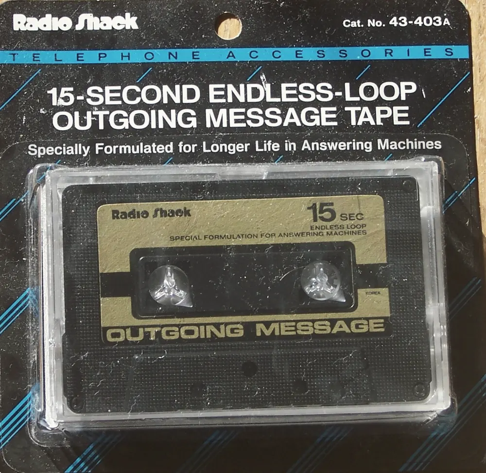 A Radio Shack 15-second endless-loop outgoing message tape in its package